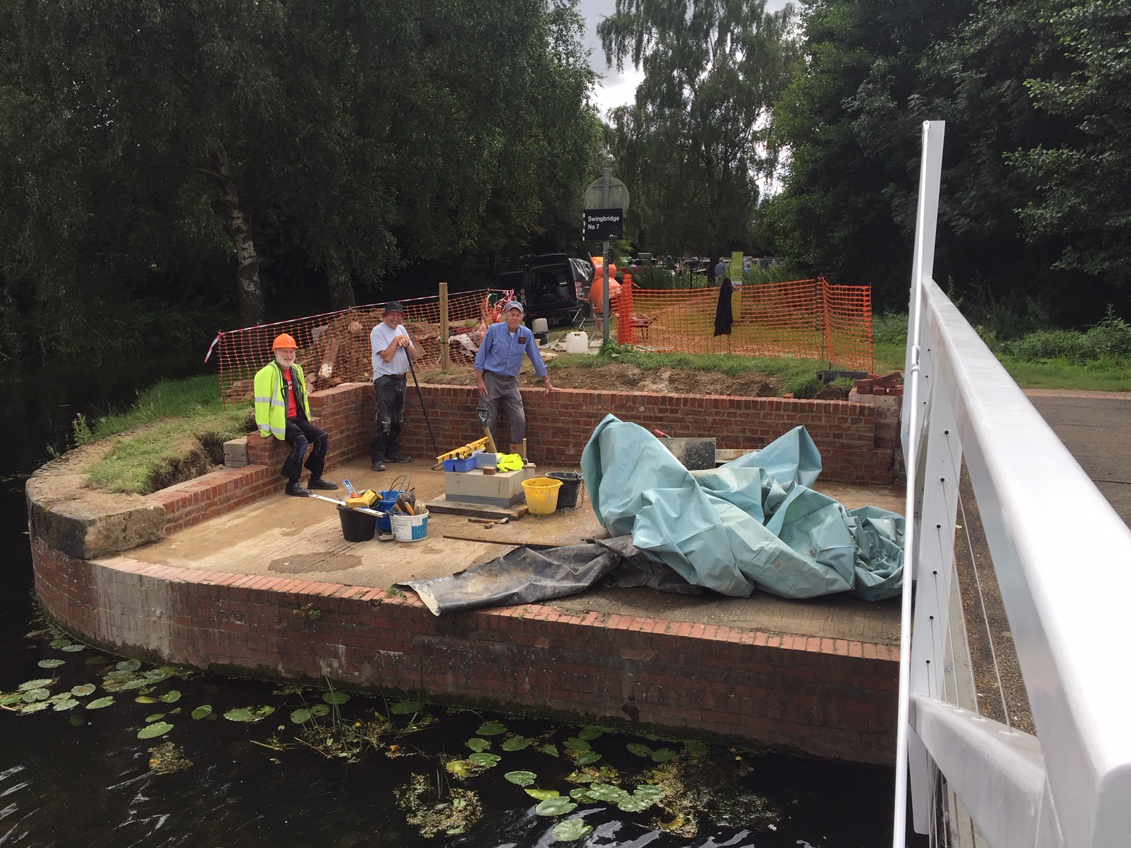 Helping Volunteers Construct Walls for Swing Bridge