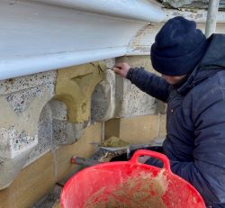 Using hydraulic lime bound stone repair materials to reface old decorative concrete