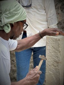 Three days of training in coral stone cutting, with hand saws, shaping with hatchets and double headed hammers, and finishing with rasps.